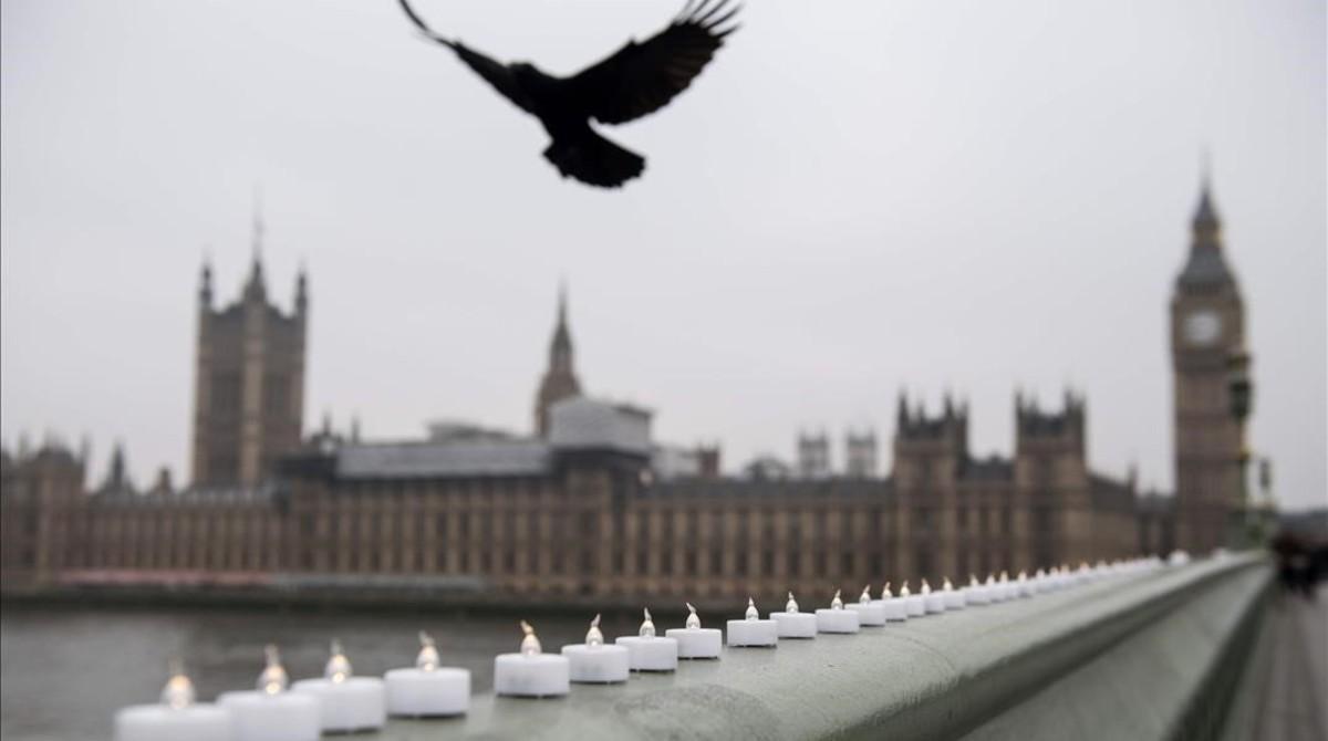 jgarcia37798945 a bird flies over electronic candles left in tribute on west170324184524