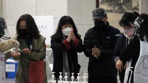 Daejeon (Korea, Republic Of), 11/04/2020.- Voters use hand sanitizers before casting their ballots on day two of early voting ahead of the upcoming general election, at a polling station in Daejeon, South Korea, 11 April 2020. The country will hold its general election on 15 April 2020. (Elecciones, Corea del Sur) EFE/EPA/YONHAP SOUTH KOREA OUT