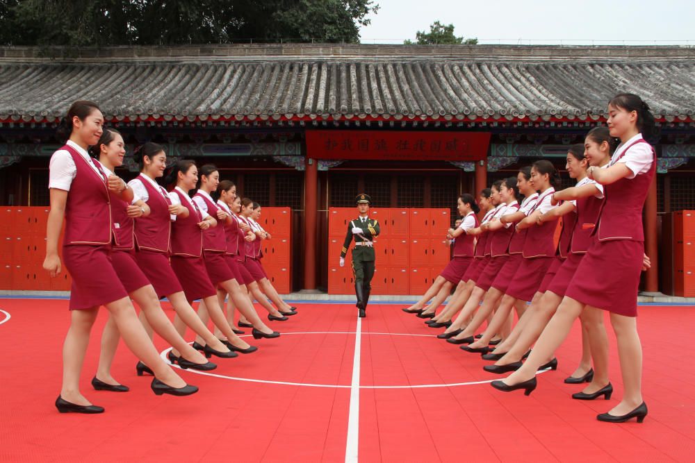 Train attendants take part in a parade training ...