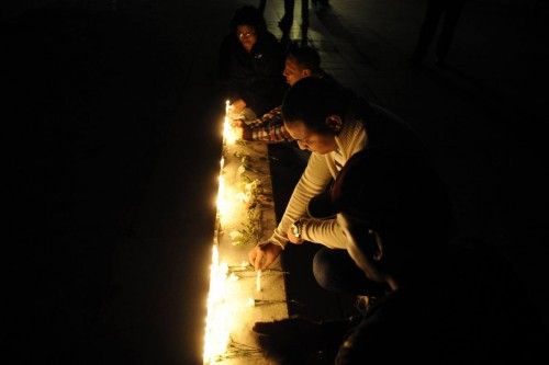 Dominican supporters of Venezuela's President Hugo Chavez light candles in Santo Domingo