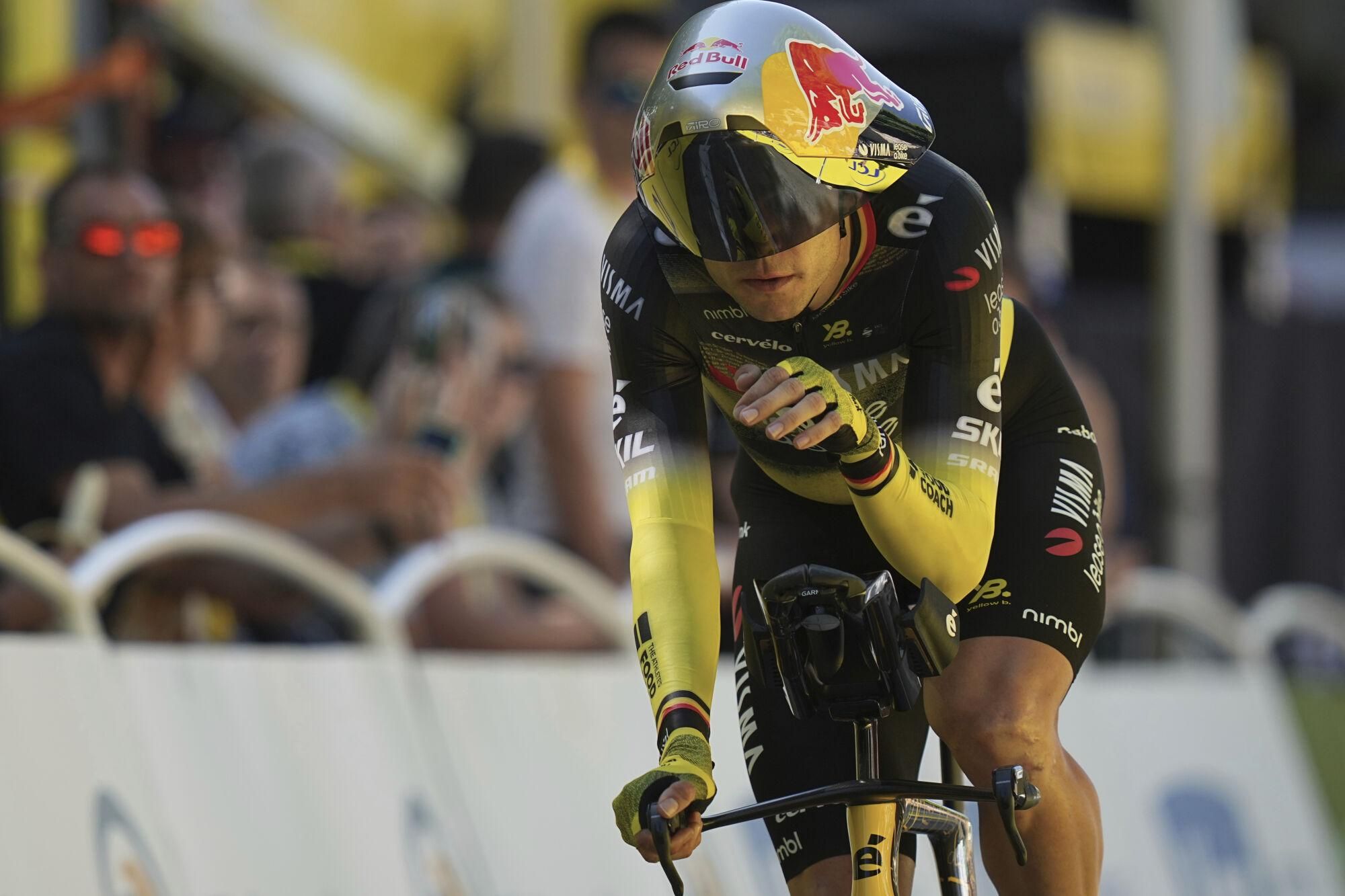 Belgium's Wout van Aert crosses the finish line during the fifth stage of the Tour de France cycling race, an indivdual time-trial over 33 kilometers (20.5 miles) with start and finish in Caen, France, Wednesday, July 9, 2025. (AP Photo/Thibault Camus)