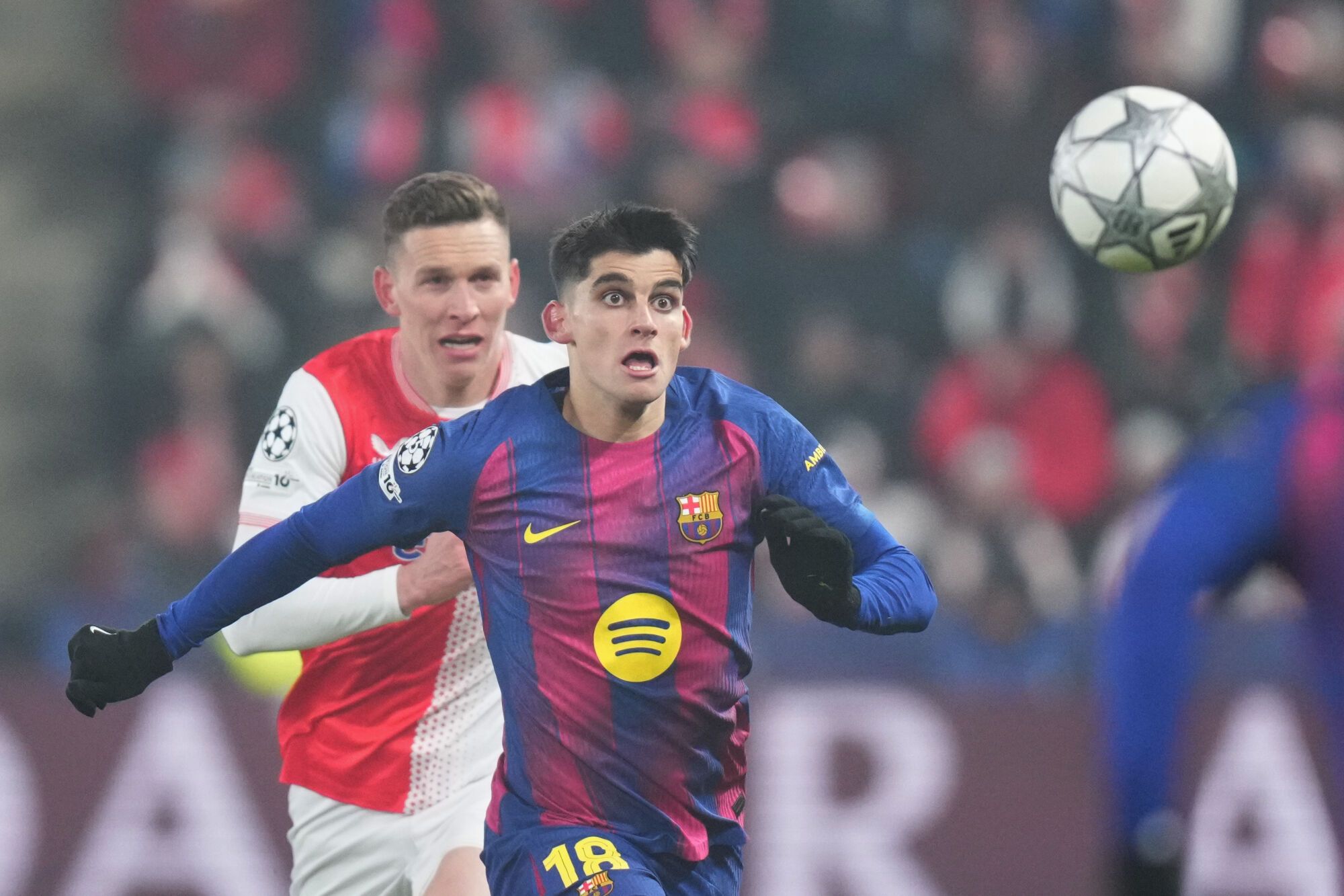 Barcelona's Gerard Martin eyes the ball during the Champions League opening phase soccer match between Slavia Prague and Barcelona in Prague, Czech Republic, Wednesday, Jan. 21, 2026. (AP Photo/Petr David Josek)