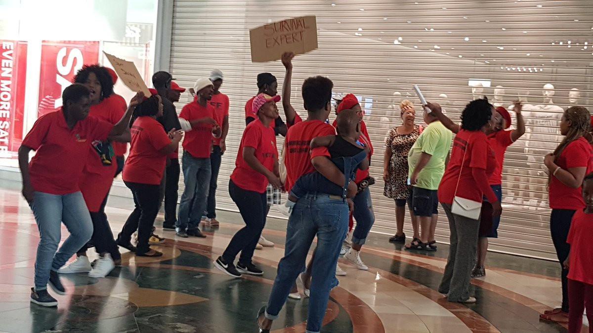 People protest in front of H&M store in Cape Town, South Africa, January 13, 2018 in this picture obtained from social media by REUTERS  THIS IMAGE HAS BEEN SUPPLIED BY A THIRD PARTY. MANDATORY CREDIT. NO RESALES. NO ARCHIVES NO NEW USES AFTER FEBRUARY 11, 2018, 23:59:59