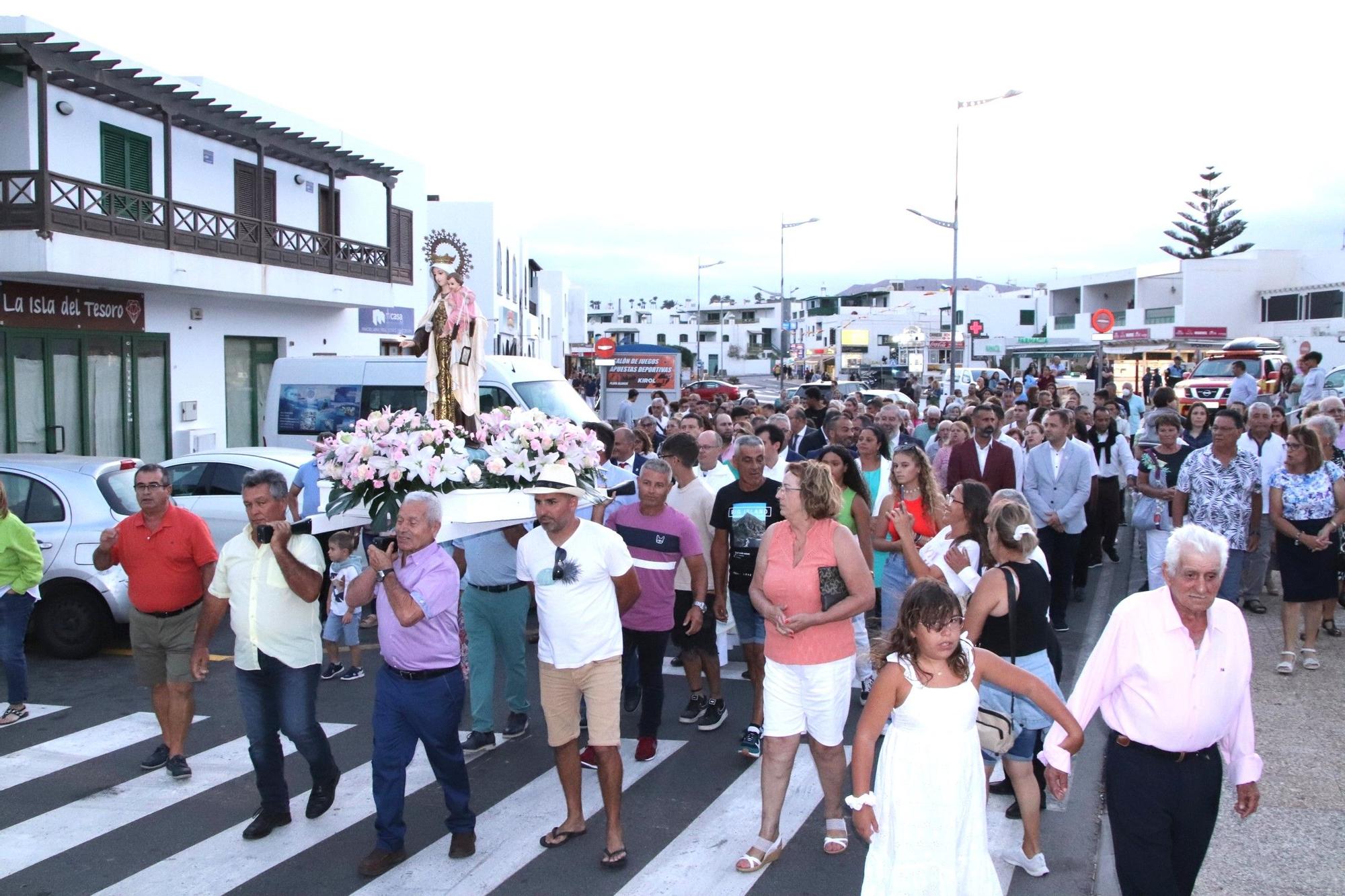 Procesión marítima y terrestre de la Virgen del Carmen en Playa Blanca