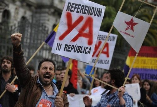 People chant slogans during an anti-royalist demonstration in Oviedo