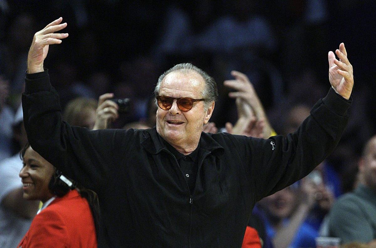 Actor Jack Nicholson waves as the crowd cheers when the scoreboard reads Happy Birthday Jack Nicholson, today is his 75th birthday, during the Los Angeles Lakers and the Oklahoma City Thunder NBA basketball game in Los Angeles, Sunday, April 22, 2012. The Lakers won 114-106 in double overtime. (AP Photo/Reed Saxon)