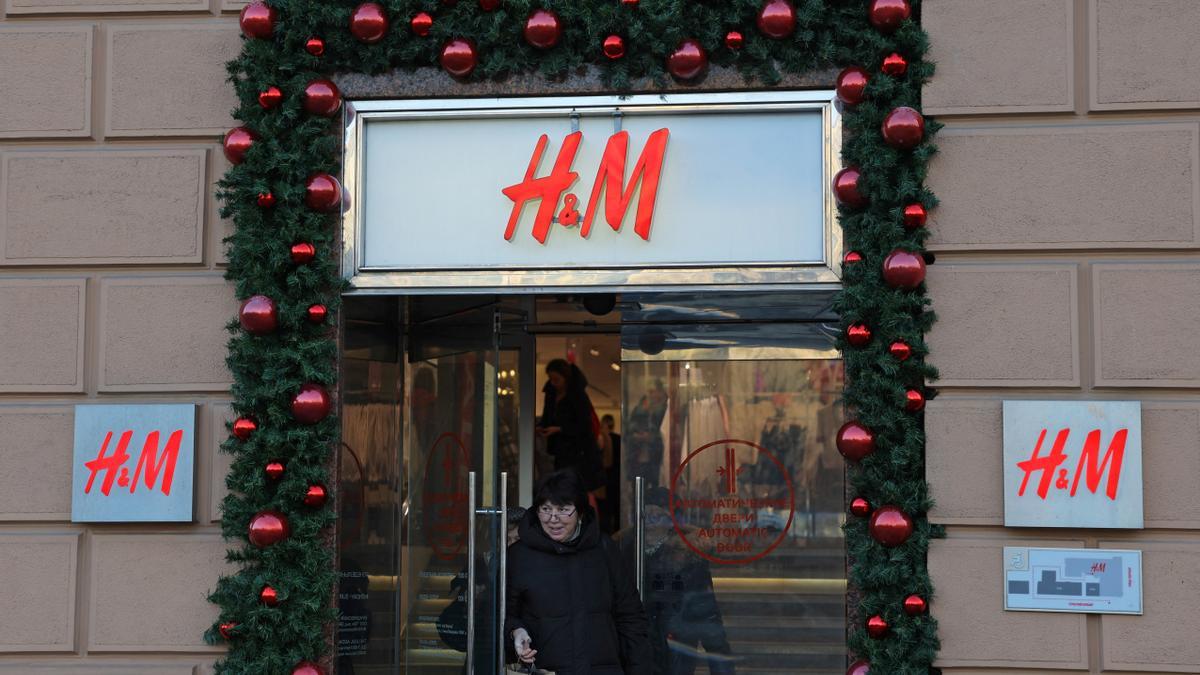 A woman walks out of an H&M store in Moscow