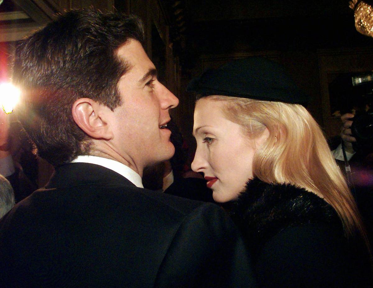 AP -LUCA BRUNO-19/07/99-MILAN- FILE-- John F. Kennedy Jr., son of late U.S. President, with his wife Carolyn Bessette Kennedy, arrive at La Scala theatre for a show in Milan Sunday, December 7, 1997. John F. Kennedy Jr. disappeared while flying with his wife and sister-in-law to a family wedding Saturday, July 17, 1999. (AP Photo/Luca Bruno)