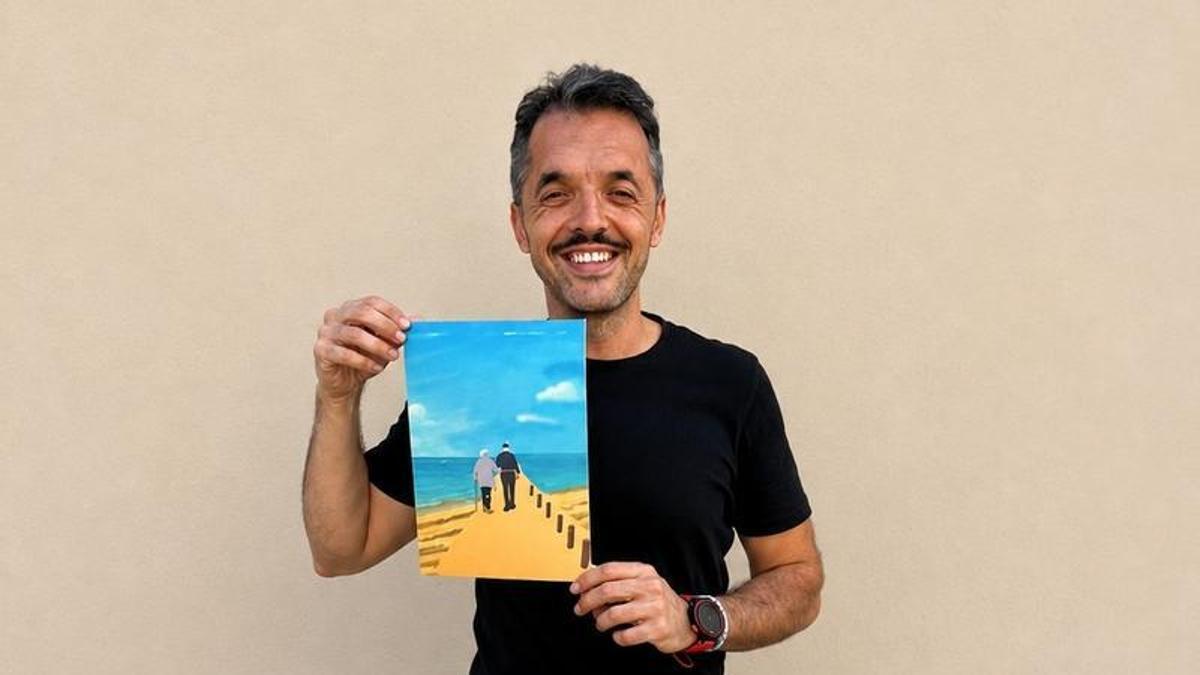 Carbonell con la ilustración que realizó a partir de la foto y que espera entregarles pronto.