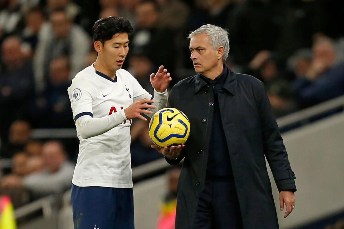 Tottenham Hotspur's South Korean striker Son Heung-Min (L) speaks with Tottenham Hotspur's Portuguese head coach Jose Mourinho (R) during the English Premier League football match between Tottenham Hotspur and Burnley at Tottenham Hotspur Stadium in London, on December 7, 2019. (Photo by Ian KINGTON / AFP) / RESTRICTED TO EDITORIAL USE. No use with unauthorized audio, video, data, fixture lists, club/league logos or 'live' services. Online in-match use limited to 120 images. An additional 40 images may be used in extra time. No video emulation. Social media in-match use limited to 120 images. An additional 40 images may be used in extra time. No use in betting publications, games or single club/league/player publications. /. HORIZONTAL