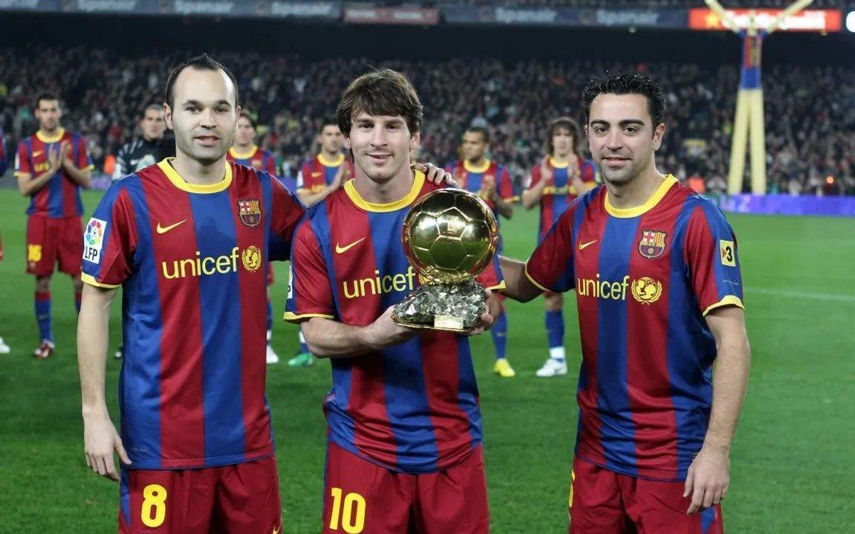 Messi, Iniesta y Xavi con el balón de oro