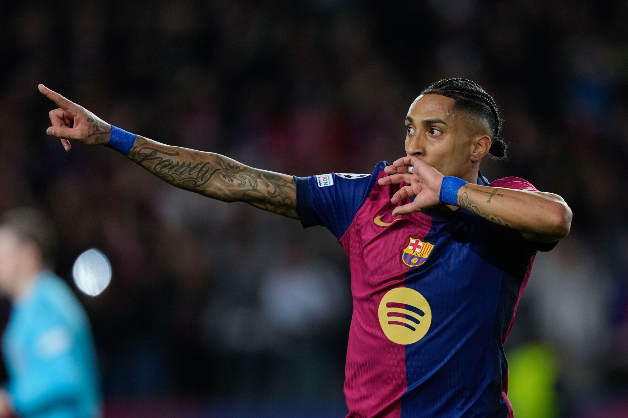 Barcelona's Brazilian midfielder Raphinha celebrates his goal against Benfica during the Champions League round of 16 second leg match between Barcelona and Benfica, at the Estadi Olimpic Lluis Companys in Barcelona, Spain, 11 March 2025. EFE/ Enric Fontcuberta