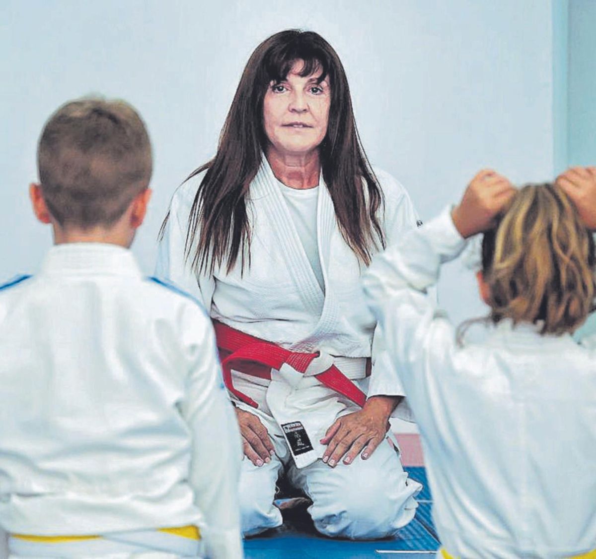 This teacher is a seventh dan black belt in Judo. | | MARIA PISACA