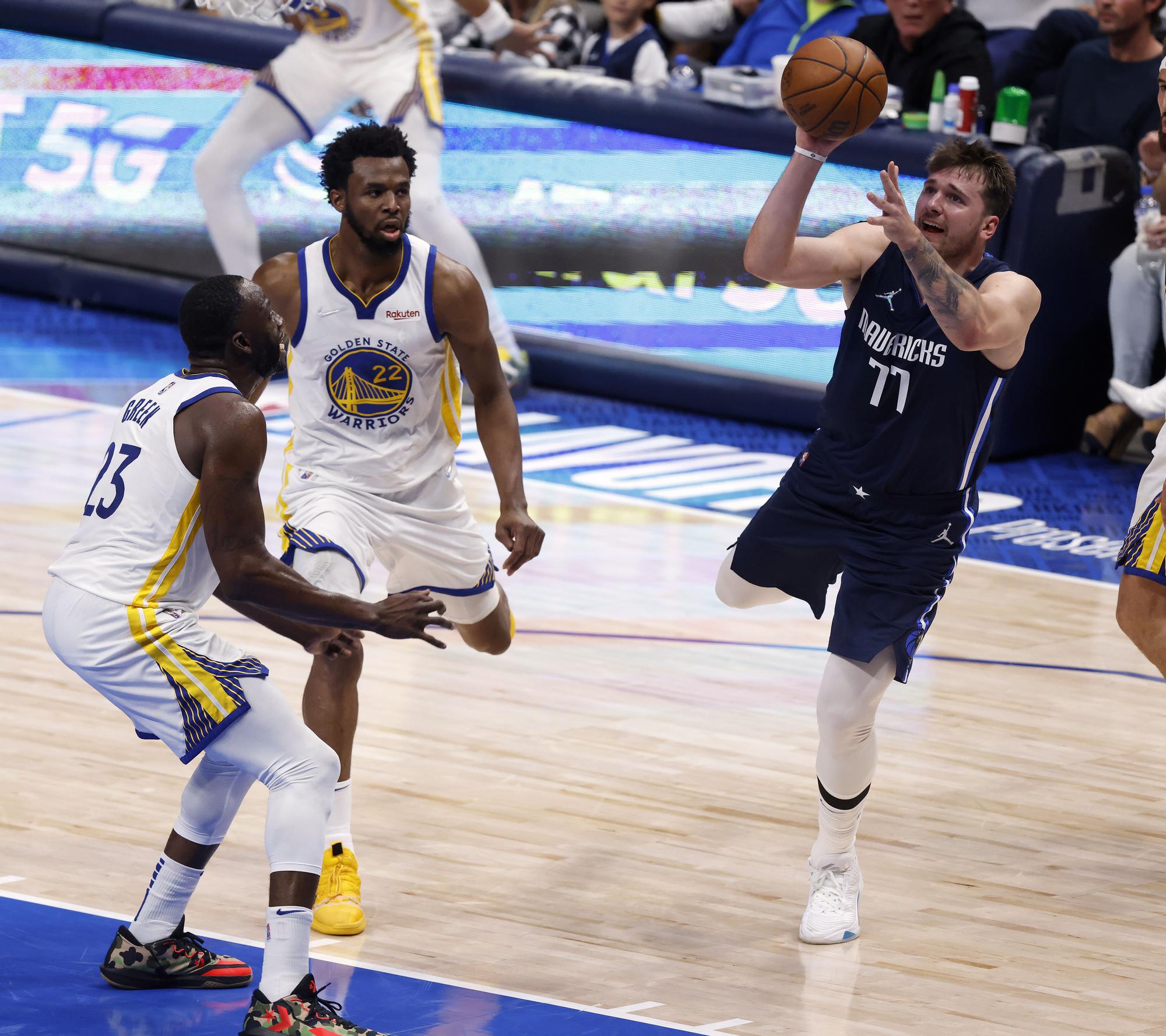 Andrew Wiggins y Draymond Green, durante el partido