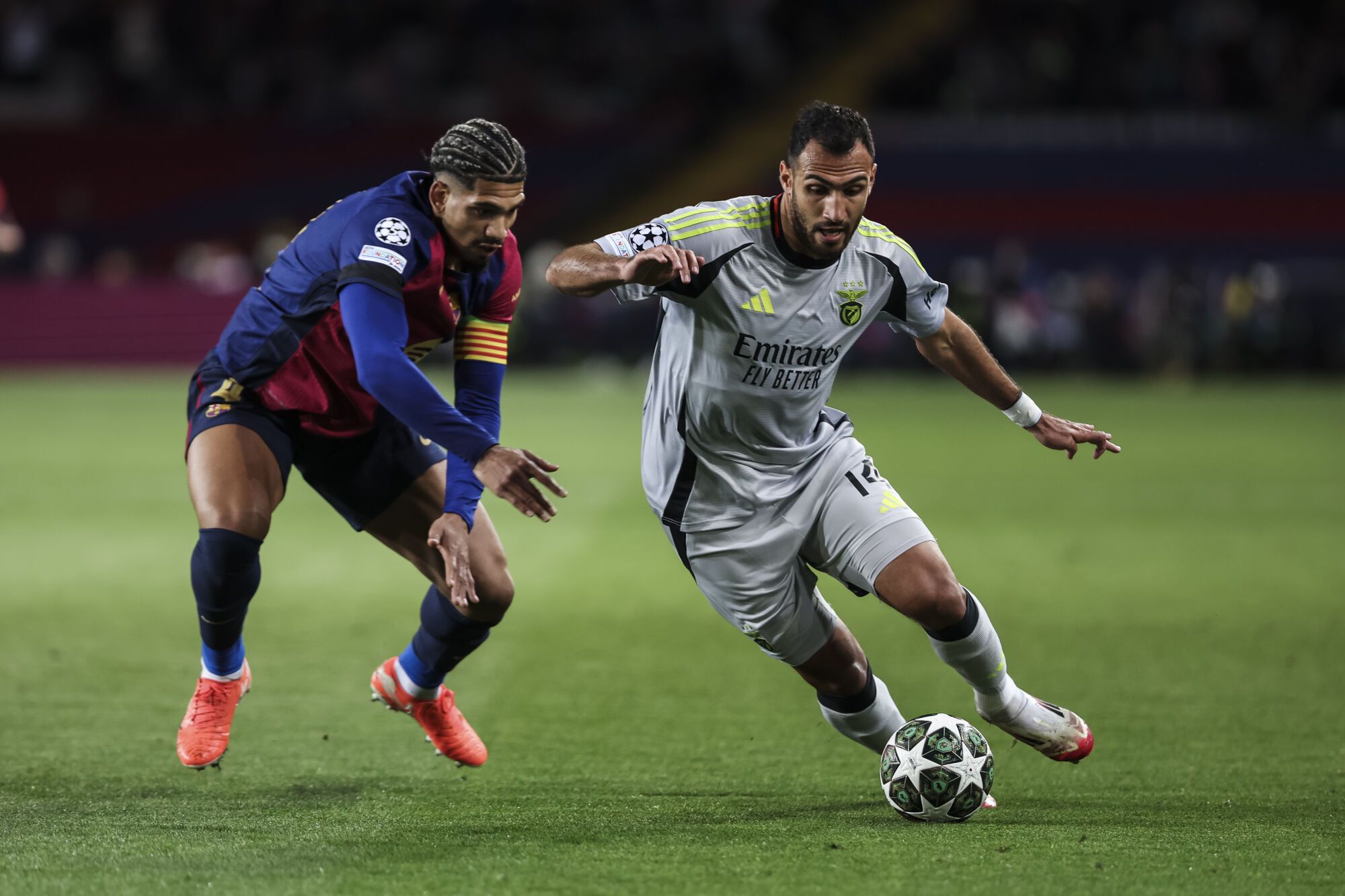 Evangelos Pavlidis of SL Benfica and Ronald Araujo of FC Barcelona in action during the UEFA Champions League 2024/25 Round of 16 second leg, match between FC Barcelona and SL Benfica at Estadi Olimpic Lluis Companys on March 11, 2025 in Barcelona, Spain. AFP7 11/03/2025 ONLY FOR USE IN SPAIN. Javier Borrego / AFP7 / Europa Press;2025;SPORT;ZSPORT;SOCCER;ZSOCCER;FC Barcelona v SL Benfica - UEFA Champions League 2024/25 Round of 16 second leg.;