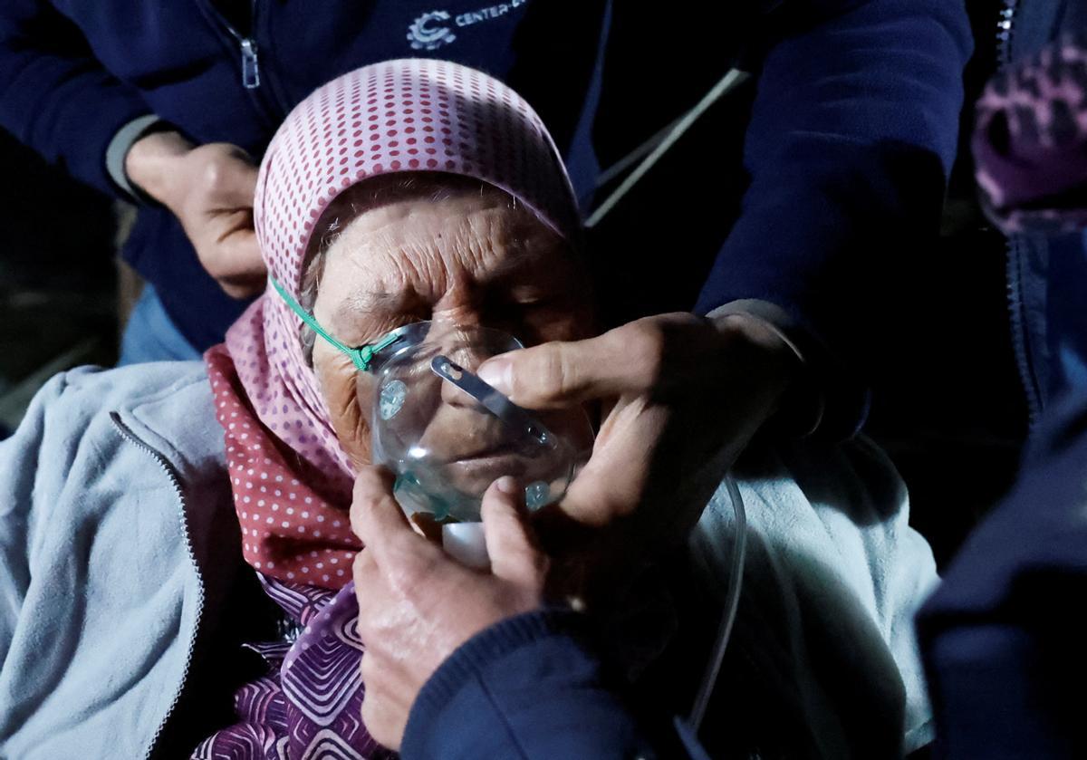 People react after a quake in Antakya in Hatay province, Turkey