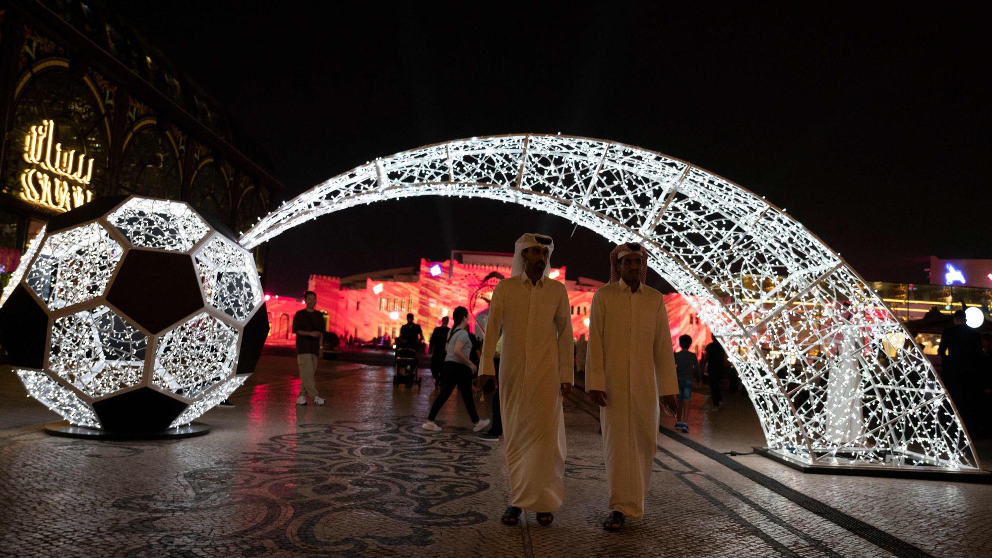 People walk along at Katara Cultural Village in Doha on November 17, 2022, ahead of the Qatar 2022 World Cup football tournament. (Photo by PABLO PORCIUNCULA / AFP)