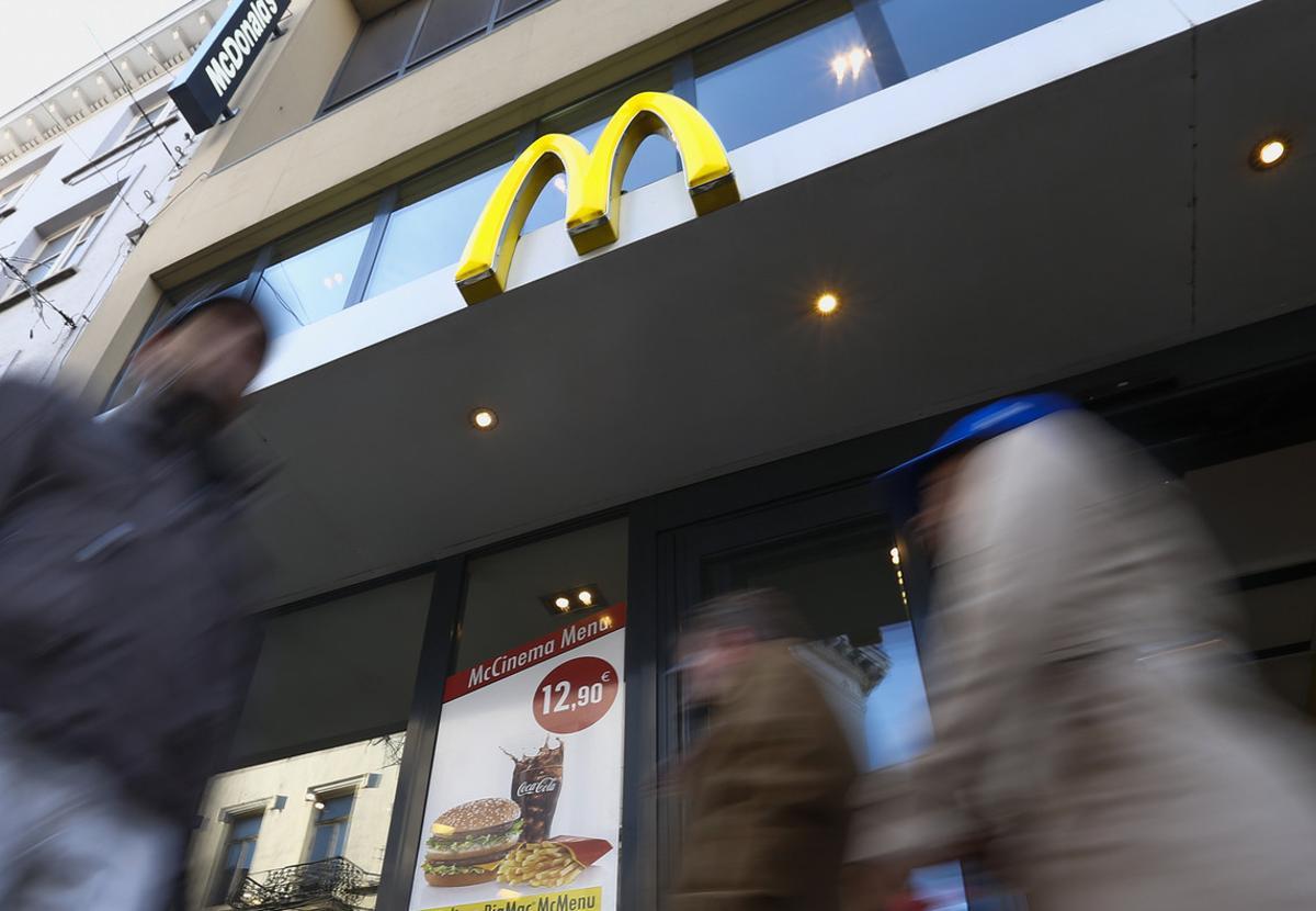 The sign for the U.S. fast food restaurant chain McDonald’s is shown outside one of their restaurants in central Brussels, Belgium December 3, 2015. EU antitrust regulators will investigate McDonald’s tax deals with Luxembourg which enabled the U.S. fastfood chain to escape paying taxes on European franchise royalties from 2009, in a move which could lead to hefty back taxes for the company. REUTERS/Yves Herman