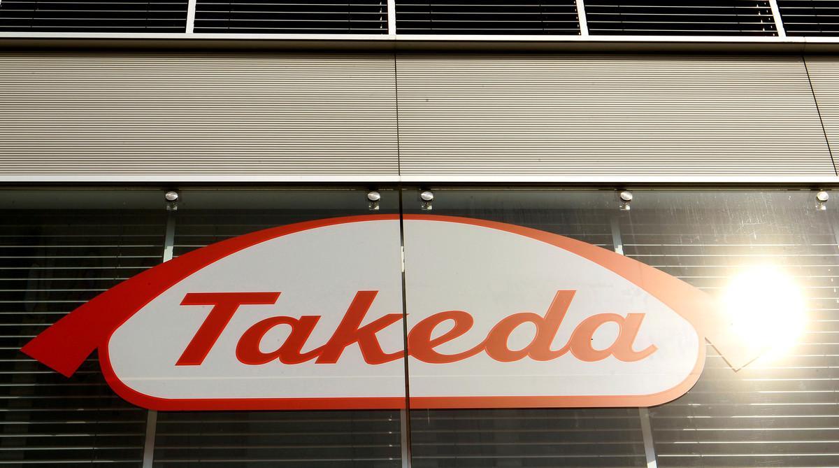 FILE PHOTO: The logo of Japanese Takeda Pharmaceutical Co is seen at an office building in Glattbrugg near Zurich March 7, 2012. REUTERS/Arnd Wiegmann/File Photo