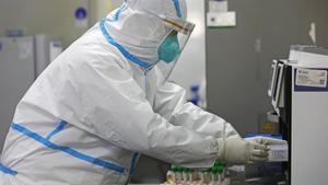 SHANGHAI, CHINA - APRIL 30: A researcher wearing a protective suit prepares nucleic acid tests at Shanghai Labway Clinical Laboratory on April 30, 2020 in Shanghai, China. (Photo by Yin Liqin/China News Service via Getty Images)
