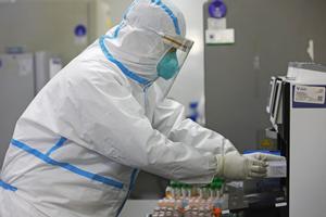 SHANGHAI, CHINA - APRIL 30: A researcher wearing a protective suit prepares nucleic acid tests at Shanghai Labway Clinical Laboratory on April 30, 2020 in Shanghai, China. (Photo by Yin Liqin/China News Service via Getty Images)