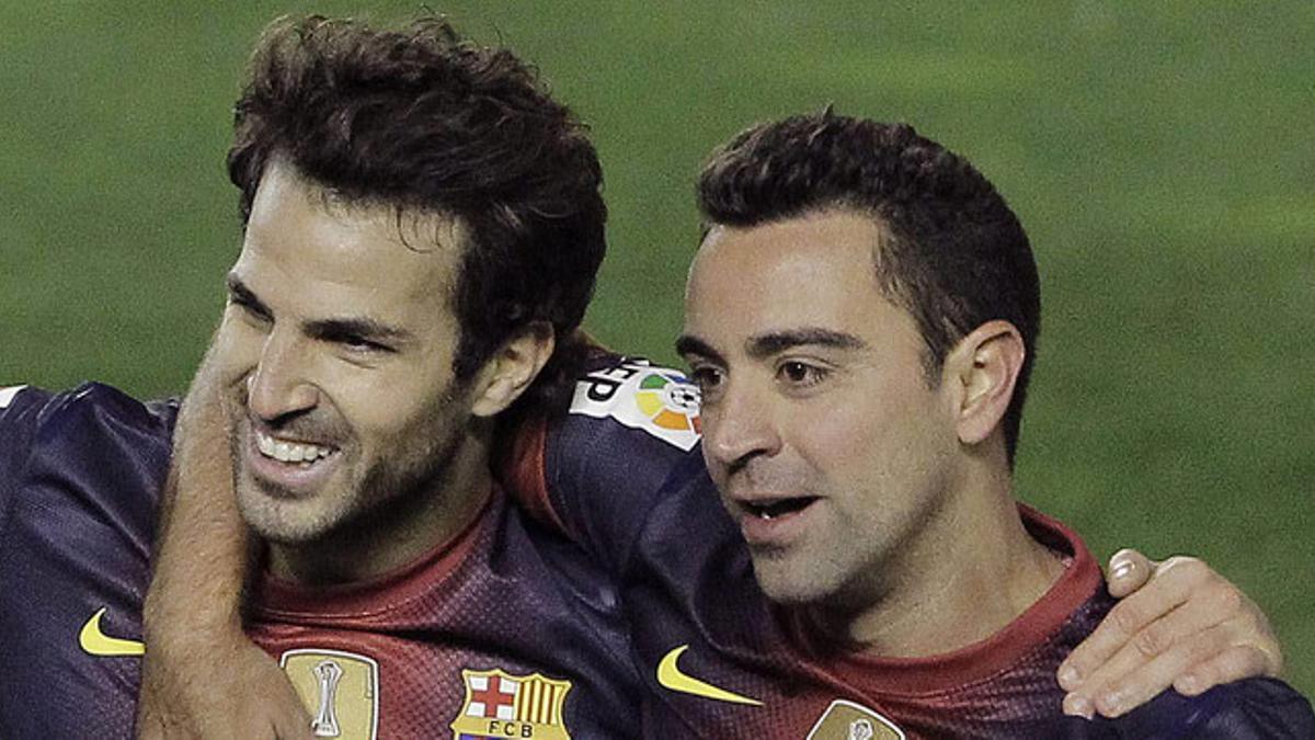 Cesc y Xavi celebran un gol del Barça