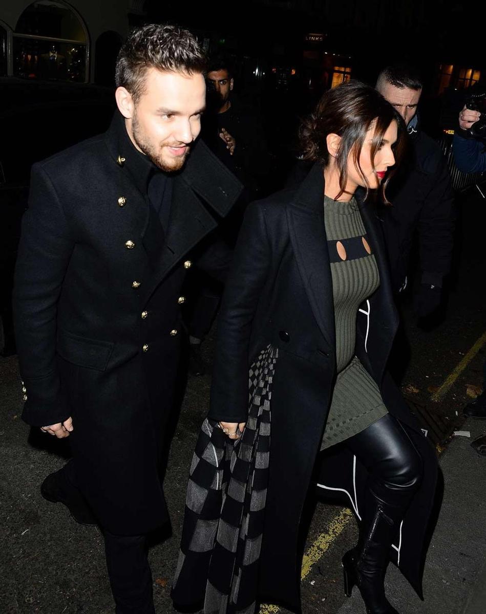 Liam Payne y Cheryl Cole saliendo de un concierto