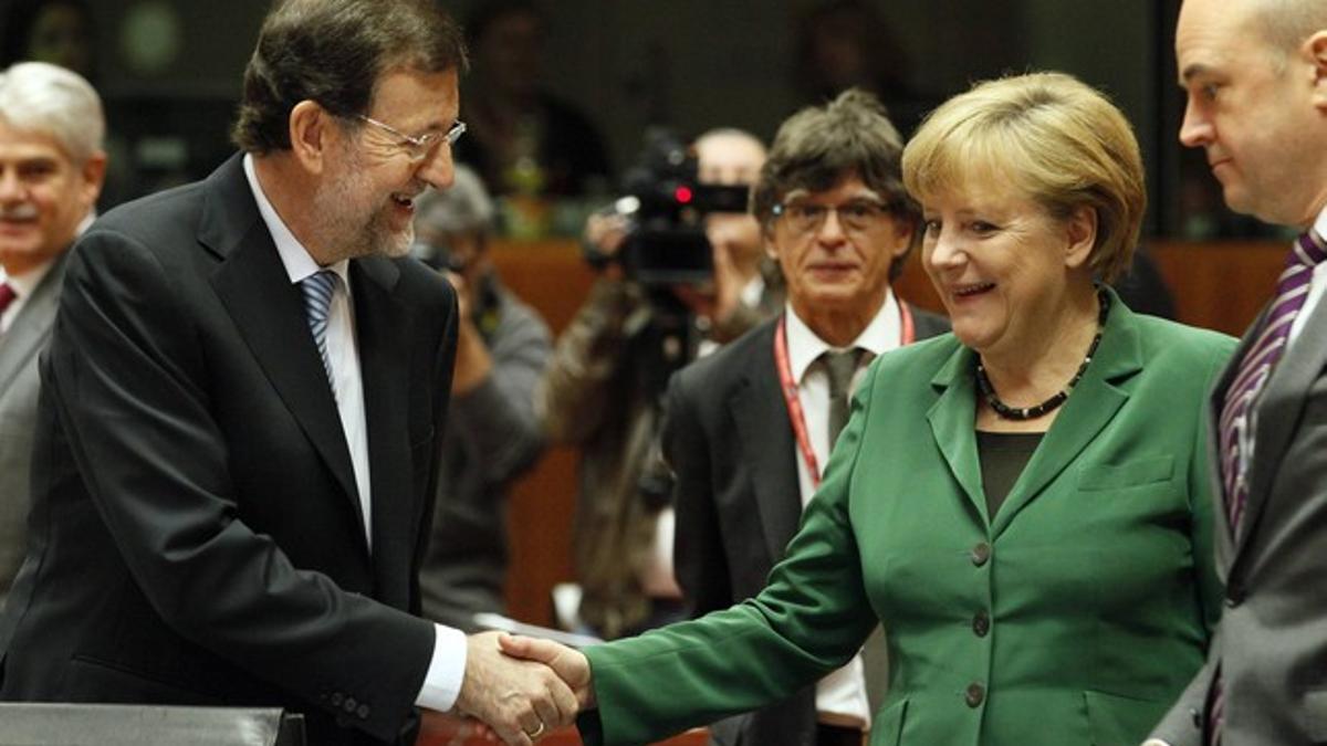 Mariano Rajoy y Angela Merkel, en la cumbre europea de Bruselas.