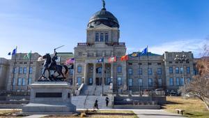 Flags adorn the Montana State Capitol in Helena