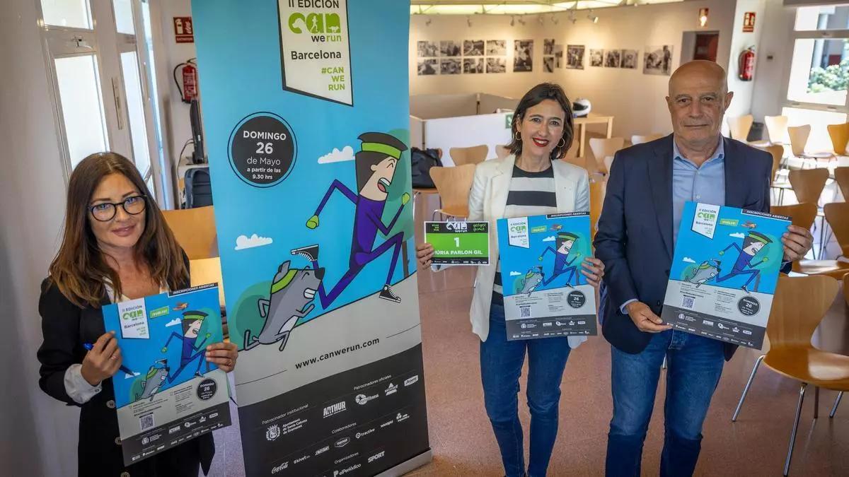 Valbuena, Parlon y Noguera sostienen el cartel de la segunda edición de la carrera 'Can We Run'.