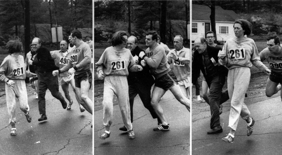 A woman, listed only as K. Switzer of Syracuse, found herself about to be thrown out of the normally all-male Boston Marathon when a husky companion, Thomas Miller of Syracuse, threw a block that tossed a race official out of the running instead, April 19, 1967 in Hopkinton, Mass.(AP PHOTO). Kathrine Switzer. Atletismo, atletas, mujeres corredoras de maraton