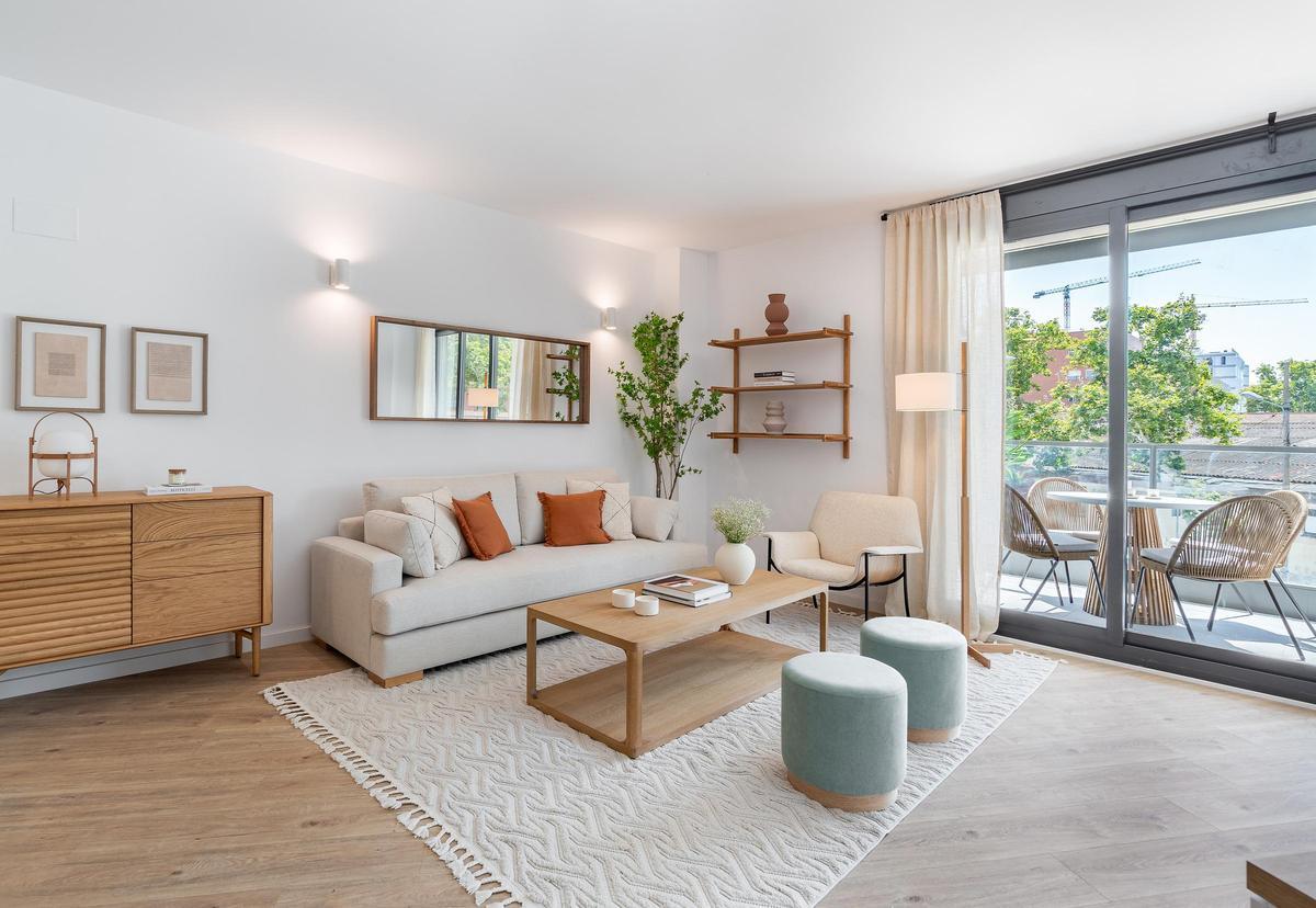 Salón del piso piloto del edificio Londres, que AQ Acentor ya levantó en el barrio.