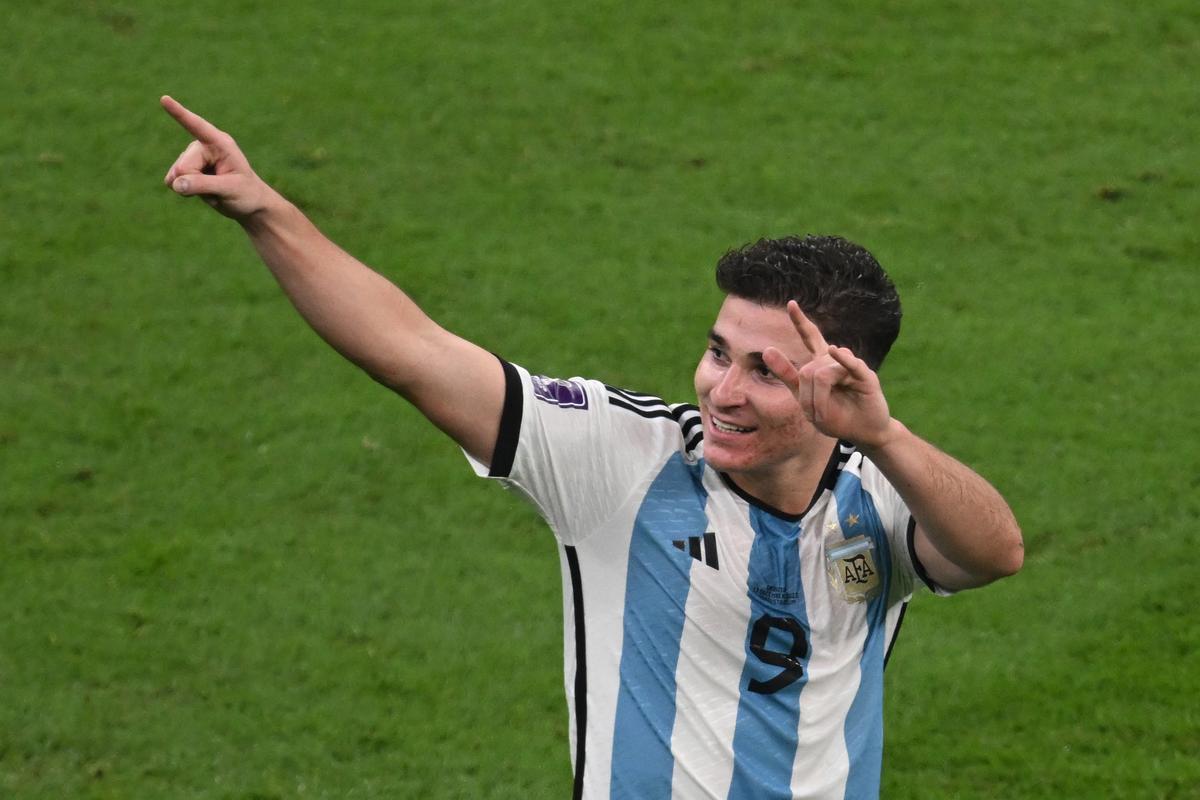 13 December 2022, Qatar, Lusail: Argentina's Julian Alvarez celebrates scoring his side's third goal during the FIFA World Cup Qatar 2022 semi final soccer match between Argentina and Croatia at the Lusail Stadium. Photo: Robert Michael/dpa