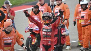 Marc Marquez from Spain from the Ducati Lenovo team celebrates after the victory at the MotoGP race, German Grand Prix, at the Sachsenring circuit, in Hohenstein-Ernstthal, Germany, Sunday July 13, 2025. (Robert Michael/dpa via AP)