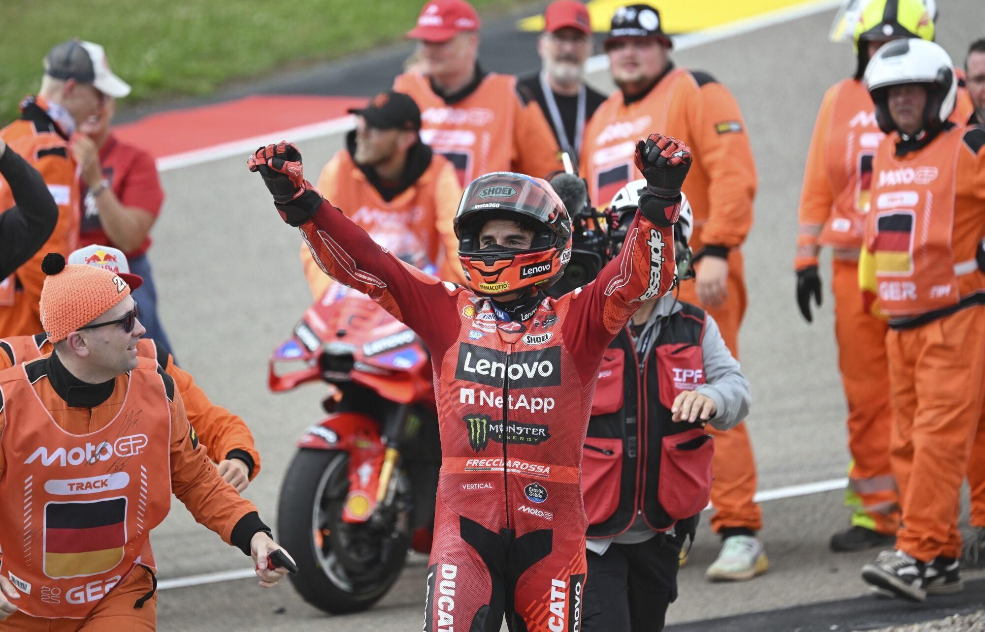 Marc Marquez from Spain from the Ducati Lenovo team celebrates after the victory at the MotoGP race, German Grand Prix, at the Sachsenring circuit, in Hohenstein-Ernstthal, Germany, Sunday July 13, 2025. (Robert Michael/dpa via AP). GERMANY OUT; MANDATORY CREDIT