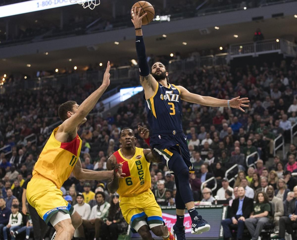 Jan 7, 2019; Milwaukee, WI, USA; Utah Jazz guard Ricky Rubio (3) shoots during the first quarter against the Milwaukee Bucks at Fiserv Forum. Mandatory Credit: Jeff Hanisch-USA TODAY Sports