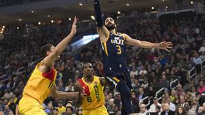 Jan 7, 2019; Milwaukee, WI, USA; Utah Jazz guard Ricky Rubio (3) shoots during the first quarter against the Milwaukee Bucks at Fiserv Forum. Mandatory Credit: Jeff Hanisch-USA TODAY Sports