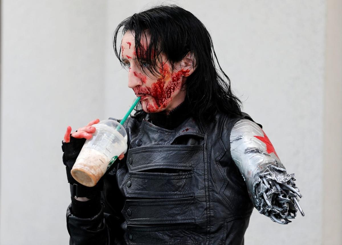 Dawn Richardson grabs a Starbucks drink in the costume of the Winter Soldier at the pop culture event Comic-Con International in San Diego  California  United States July 22  2016     REUTERS Mike Blake