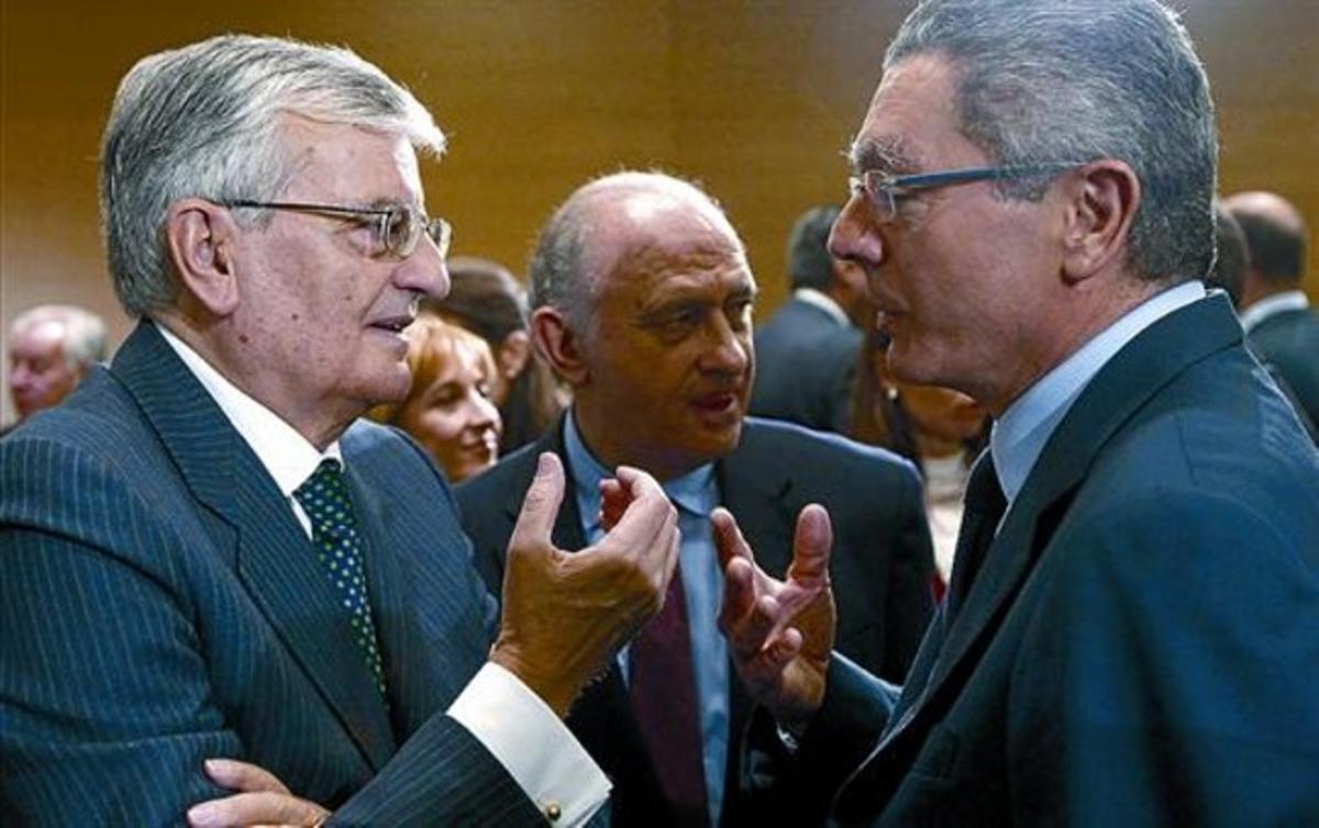 El fiscal general, Eduardo Torres Dulce; Jorge Fernández Díaz, i Alberto Ruiz-Gallardón, dilluns a Interior.