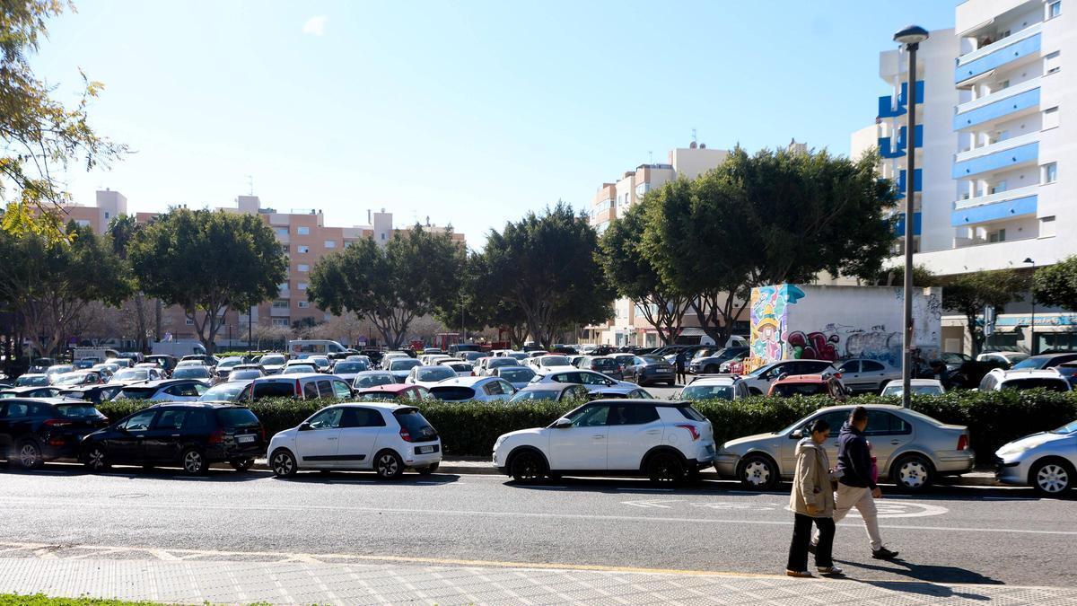 Cars parked in the boulevard area.