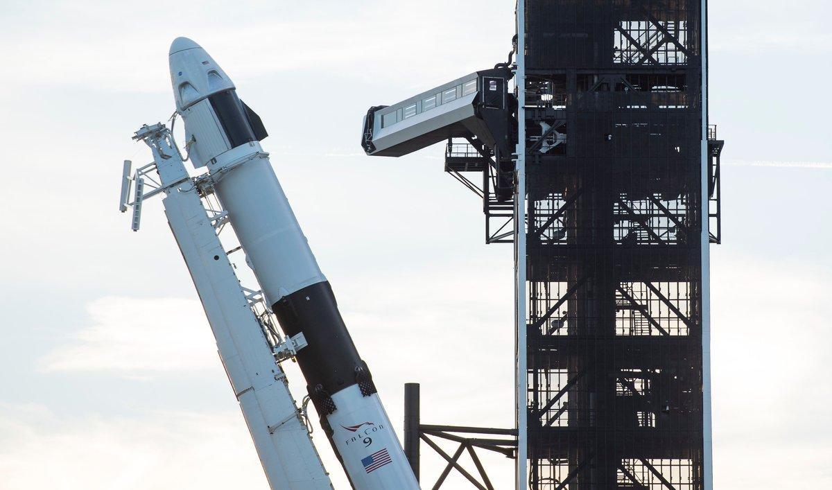 This handout photo released by NASA shows A SpaceX Falcon 9 rocket with the company’s Crew Dragon spacecraft onboard as it is raised into a vertical position on the launch pad at Launch Complex 39A as preparations continue for the Demo-1 mission on February 28, 2019 at the Kennedy Space Center in Florida. - The Demo-1 mission will be the first launch of a commercially built and operated American spacecraft and space system designed for humans as part of NASA’s Commercial Crew Program. The mission, currently targeted for a 2:49am launch on March 2, will serve as an end-to-end test of the system’s capabilities. (Photo by NASA/Joel Kowsky / NASA / AFP) / -----EDITORS NOTE --- RESTRICTED TO EDITORIAL USE - MANDATORY CREDIT AFP PHOTO / NASA / JOEL KOWSKY  - NO MARKETING - NO ADVERTISING CAMPAIGNS - DISTRIBUTED AS A SERVICE TO CLIENTS
