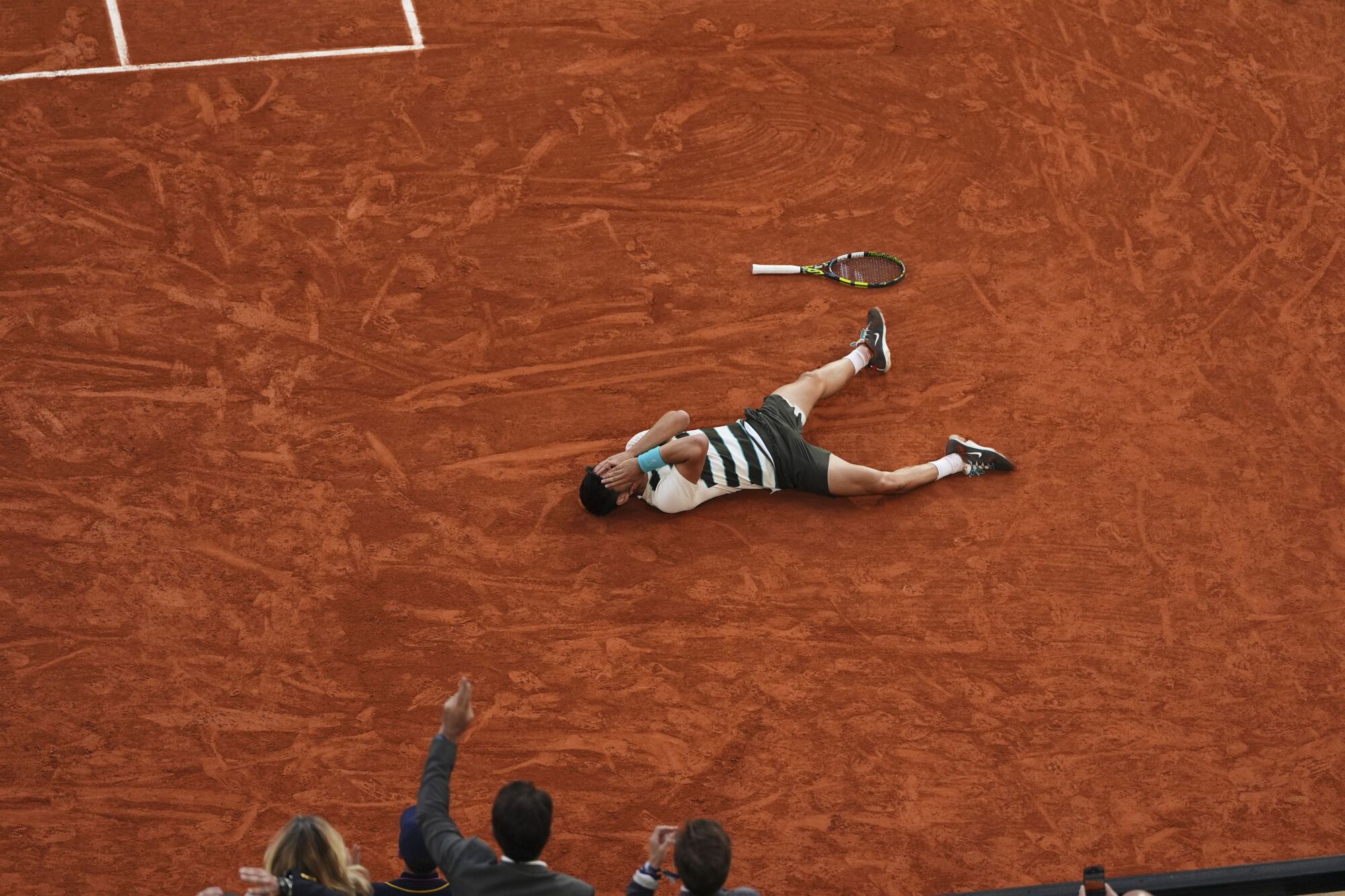 Spain's Carlos Alcaraz celebrates after winning the final match of the French Tennis Open against Italy's Jannik Sinner at the Roland-Garros stadium in Paris, Sunday, June 8, 2025. (AP Photo/Lindsey Wasson)