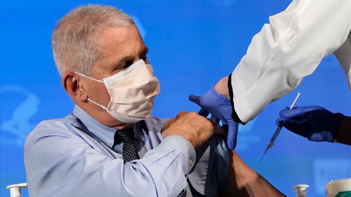 Anthony Fauci director of the National Institute of Allergy and Infectious Diseases prepares to receive his first dose of the Covid-19 vaccine at the National Institutes of Health on December 22 2020 in Bethesda Maryland (Photo by Patrick Semansky POOL AFP) Anthony Fauci director of the National Institute of Allergy and Infectious Diseases prepares to receive his first dose of the Covid-19 vaccine at the National Institutes of Health on December 22 2020 in Bethesda Maryland (Photo by Patrick Semansky POOL AFP)