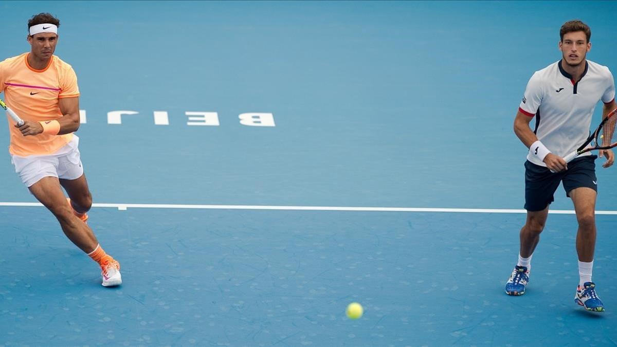 Nadal y Carreño jugando el dobles del Open de China