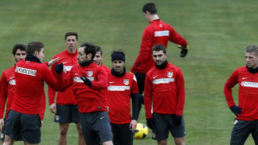 Los jugadores del Atlético de Madrid, durante el entrenamiento