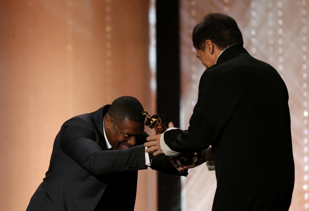 Actor Chris Tucker present Jackie Chan with his ...