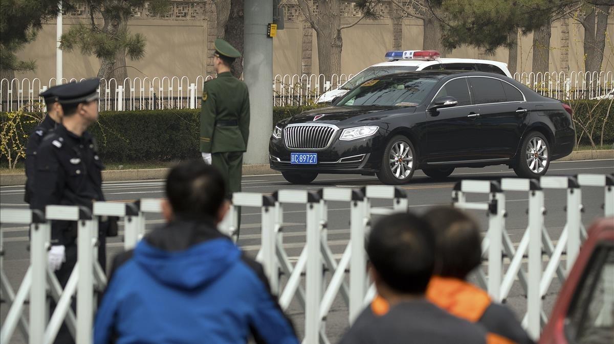 mbenach42683561 police and security officials stand guard as a motorcade tra180327114112