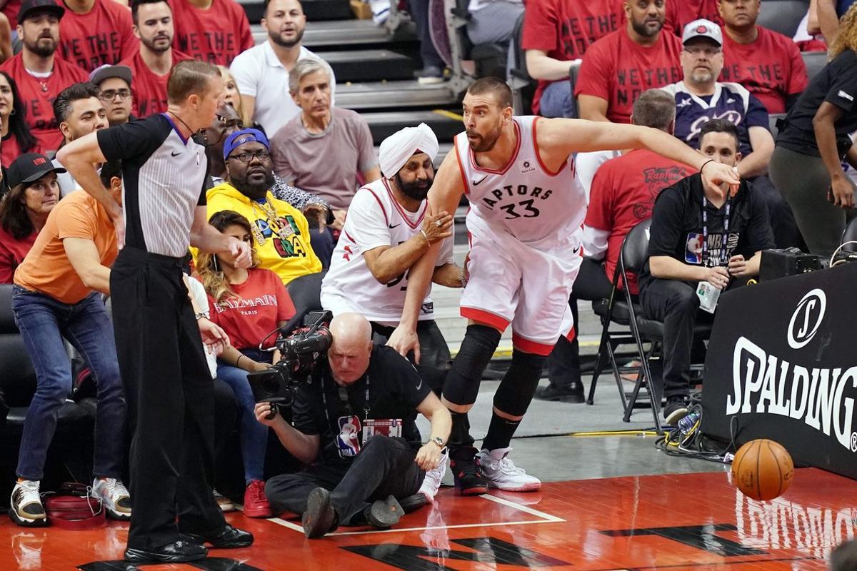 Jun 2  2019  Toronto  Ontario  CAN  Toronto Raptors center Marc Gasol  33  collides with Raptors fan Nav Bhatia during the second quarter in game two of the 2019 NBA Finals at Scotiabank Arena  Mandatory Credit  Kyle Terada-USA TODAY Sports