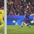 Barcelonas Fermin Lopez, center, scores his sides opening goal past Slavias David Moses, right, and Slavias goalkeeper Jindrich Stanek during the Champions League opening phase soccer match between Slavia Prague and Barcelona in Prague, Czech Republic, Wednesday, Jan. 21, 2026. (AP Photo/Petr David Josek)