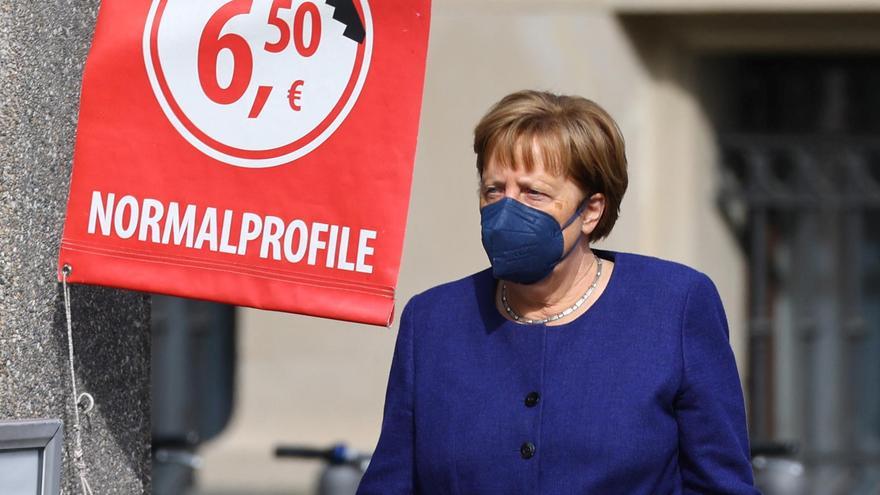 Former German Chancellor Merkel walks on a public street in Berlin